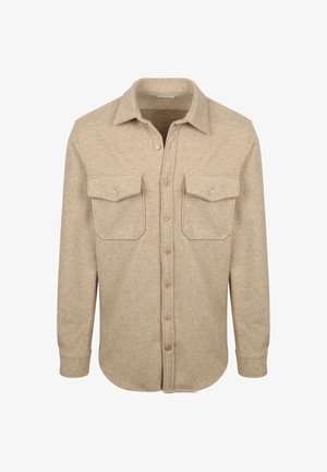 Beige, long-sleeve button-up shirt made of soft, textured fabric. Features two chest pockets and a classic collar design.