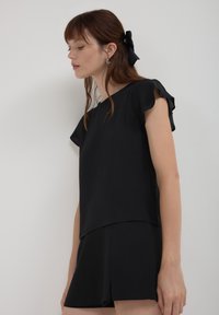 Calliope CON VOLANT - Camicetta - noir