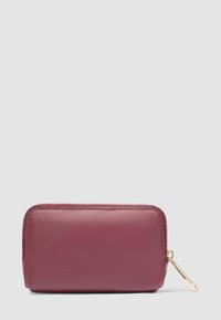 Maroon leather wallet with a smooth texture, rectangular shape, gold zipper hardware, and minimalistic design.