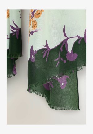 Helle grüne Stoffschal mit lilanen Blumenmustern und orangefarbenen Akzenten, mit Fransen an den Rändern für zusätzliche Textur und Detail.