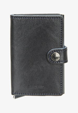 Black leather Secrid wallet with snap closure and visible metal button on the strap, compact and stitched edges.