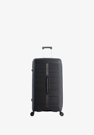 Black hard-shell suitcase with vertical ribbed texture, a retractable handle, and four wheels. Features a central zipper and gray accents.