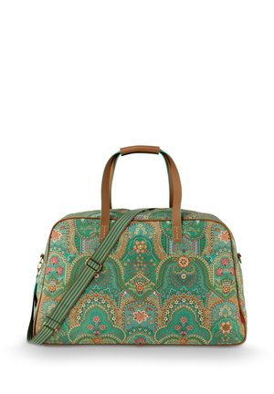 Green patterned duffel bag with floral and paisley designs, tan leather accents, dual handles, and a removable striped shoulder strap.