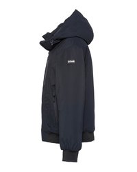 Marineblauwe geïsoleerde jack met een capuchon, voorzien van een ritsluiting, zijzakken en geribbelde manchetten voor een veilige pasvorm. Waterdicht materiaal.