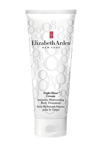 Biała plastikowa tubka z szarymi okrągłymi wzorami, oznaczona jako "Krem Ośmiogodzinny". Zawiera intensywną pielęgnację nawilżającą do ciała. Zakrętka na twist.