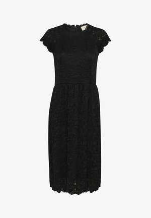 Svart spetsklänning med rund halsringning och korta fjärilskjolar. Har en åtsittande bodice och en utsvängd kjol med en scallopad fåll.