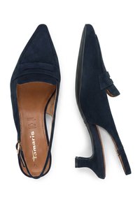Paire de chaussures slingback bleu marine en daim avec bouts pointus et talons bas, l'une vue de dessus et l'autre de côté.