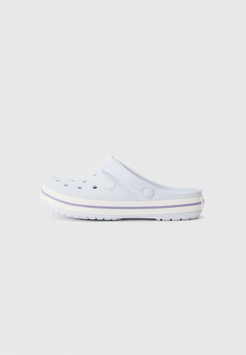 Light blue clog featuring perforations for ventilation, a flat sole with white and purple stripes, and a raised back strap for secure fit.