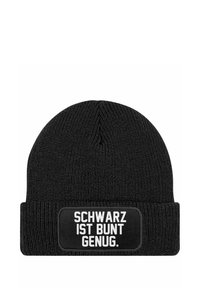 Black knit beanie with a folded cuff featuring a rectangular patch displaying the text "SCHWARZ IST BUNT GENUG." in white lettering.