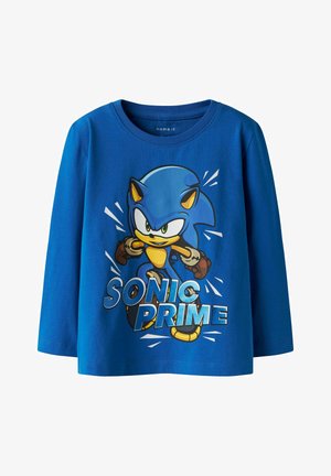 Maglietta a maniche lunghe blu in cotone, con una grafica di Sonic the Hedgehog e la scritta "SONIC PRIME" in caratteri in grassetto.