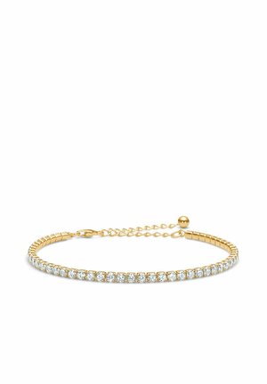 Złota bransoletka o elastycznym designie, zdobiona wieloma przezroczystymi kamieniami szlachetnymi, z przedłużeniem łańcuszka umożliwiającym regulację rozmiaru.