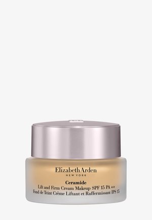 Pot de crème maquillage Elizabeth Arden Ceramide Lift and Firm avec SPF 15, verre dépoli et couvercle métallique or rose.