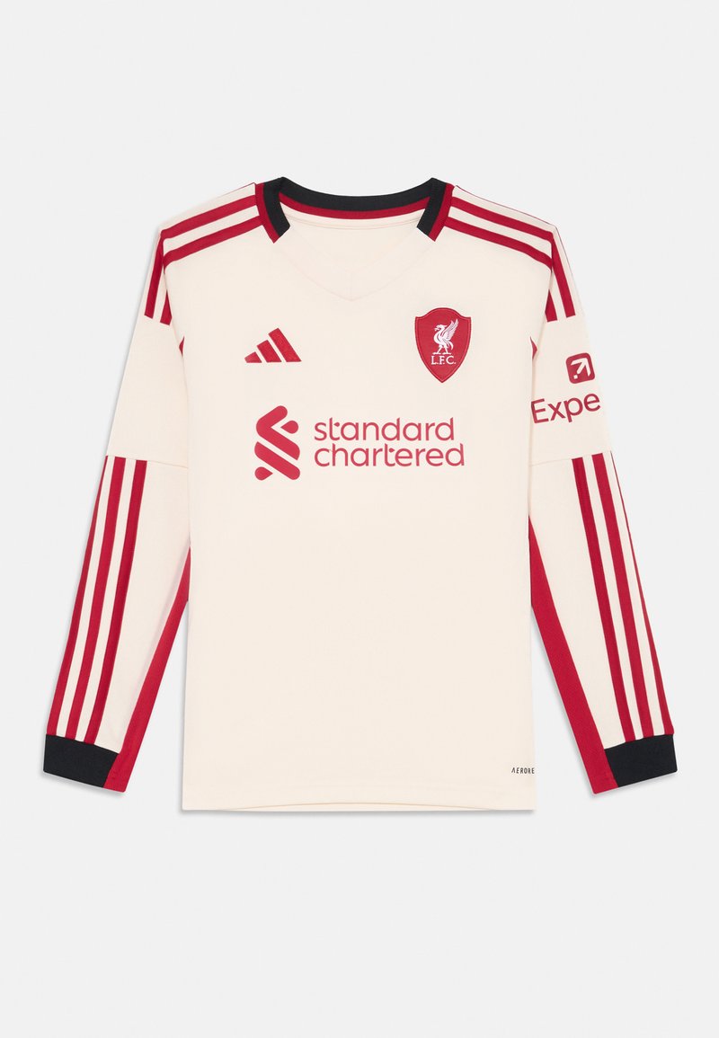 Duguljasta Liverpool FC majica tamnosmeđe boje s crvenim prugama, s v-izrezom, klupskim logotipom i logotipom sponzora na prednjoj strani. Crni akcenti na rukavima.