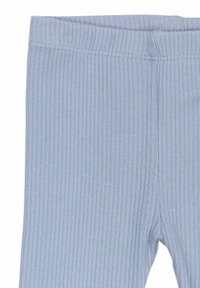 Heledad sinine triibuline sukkpüksid pehme tekstuuriga, elastse vöökoha ja hea sobivusega. Ilma nähtavate mustrite või metalldetailideta.
