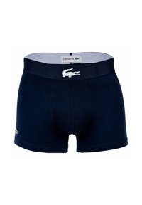 Boxer shorts en coton bleu marine avec un logo Lacoste blanc sur la ceinture. Ils sont dotés d'un band élastique doux et d'un design ajusté.