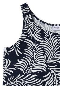 Haut sans manches bleu marine avec motif de feuilles tropicales blanches et petit détail en tissu sur la bretelle gauche.