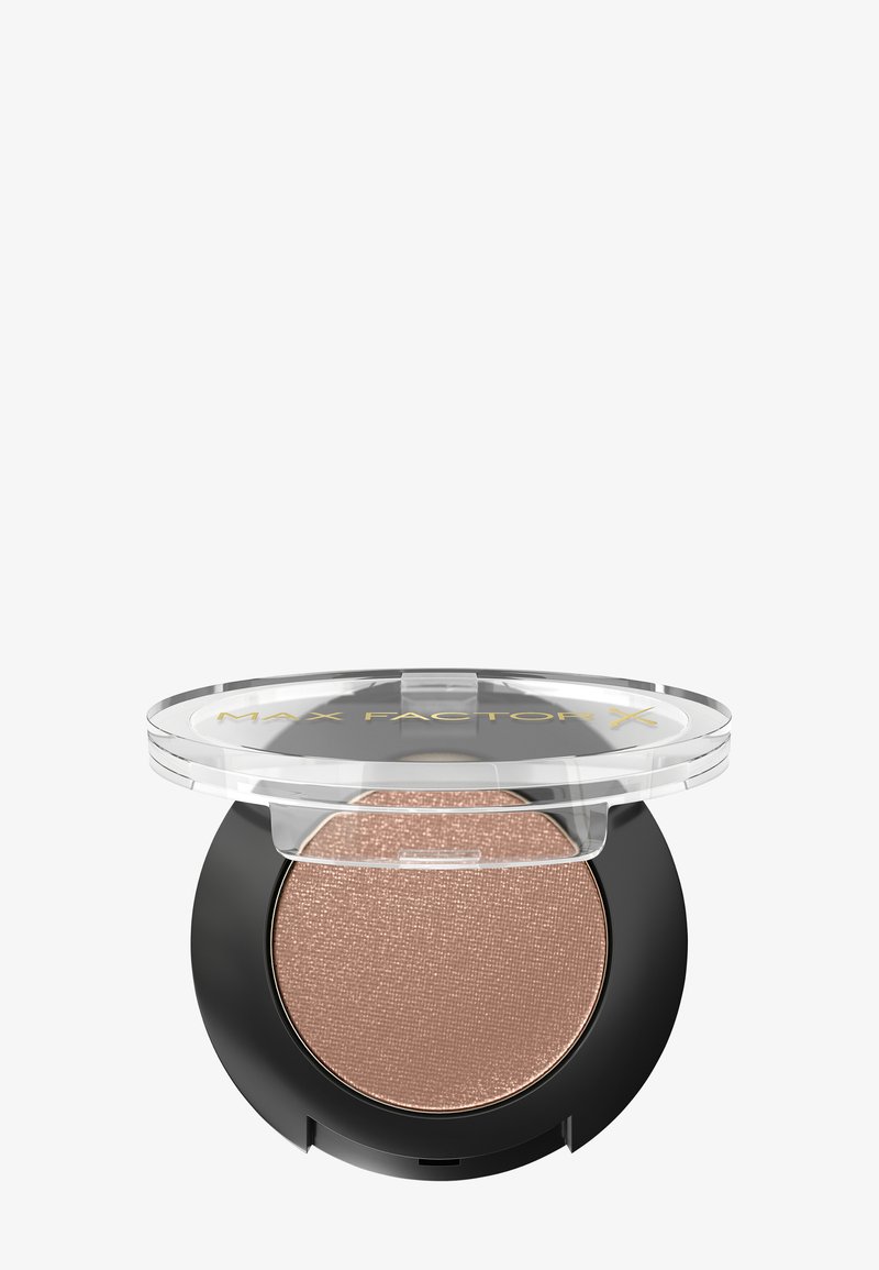 Brązowy cień do powiek z połyskiem w okrągłym opakowaniu z przezroczystą pokrywką, z czarnym dnem i złotym logo "Max Factor X".