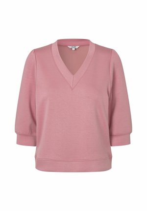 Rožinė palaidinė su V formos iškirpte, alkūnės ilgio pūstomis rankovėmis ir prigludusia juosmens juosta, pagaminta iš lygaus, lengvo audinio.