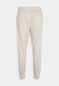 Nike Sportswear Träningsbyxor - off-white