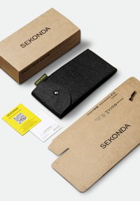 Black felt watch case with snap closure, packaged in a kraft cardboard box labeled "SEKONDA." Includes warranty and care cards.