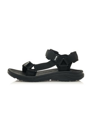 Sandalias negras de exterior con correas ajustables, plantillas texturizadas y suela de goma moldeada, diseñadas para la comodidad y el soporte.