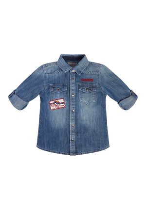 Blue denim button-up shirt with rolled sleeves, two chest pockets, a red "GUESS" logo, and a colorful patch on the left pocket area.