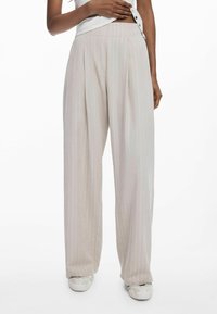 Pleated wide-leg trousers in light beige with subtle vertical stripes. Made of smooth fabric; features a relaxed fit and high waist.