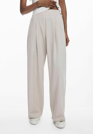 Pleated wide-leg trousers in light beige with subtle vertical stripes. Made of smooth fabric; features a relaxed fit and high waist.