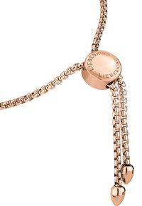 Rose gold necklace with a round clasp featuring imprinted text. Dual chains end in smooth, rounded tips, displaying a sleek design.