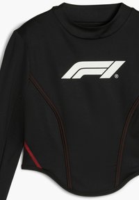 Zwarte langemouwen top gemaakt van gladde stof, met een wit F1-logo en rode accenten langs de zijnaad. Hoge kraag ontwerp.