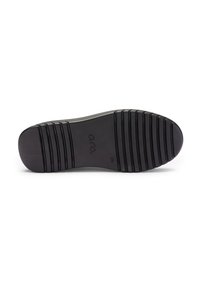 Black rubber shoe sole with horizontal grooves, featuring a smooth contour and rounded toe, marked with brand name and size.