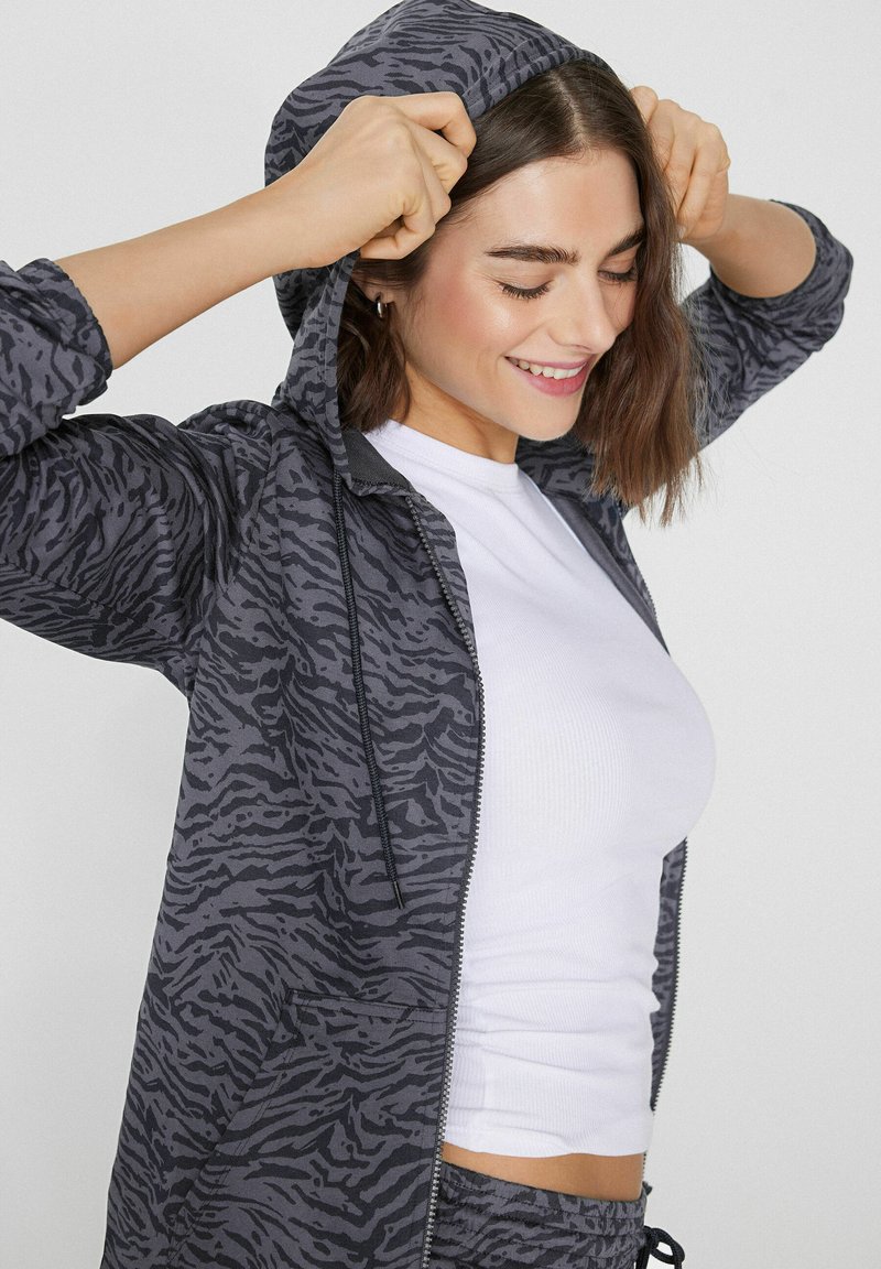 Dames lichtgewicht hoodies met rits lange mouw effen kleur oversized sweatshirts casual losse capuchon jassen met zakken trekkoord rits hoodies casual
