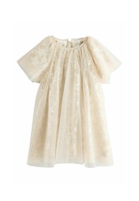 Robe beige pâle avec de courtes manches bouffantes, en tissu transparent orné de sequins scintillants et de motifs d'étoiles. Fermeture à boutons au dos.