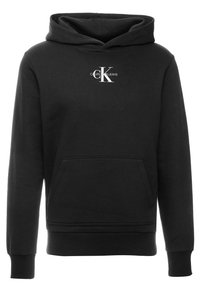 Sudadera negra de tela de mezcla de algodón, con un bolsillo tipo canguro en la parte delantera, puños acanalados y un logo blanco de "Calvin Klein Jeans" en el pecho.