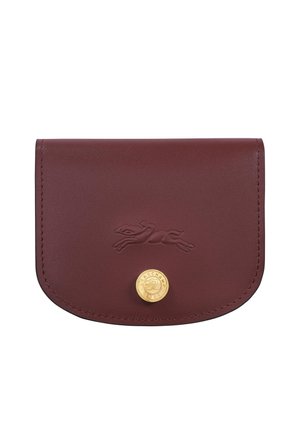 Burgundy leather wallet with embossed running dog logo and round gold button featuring the Longchamp brand name.