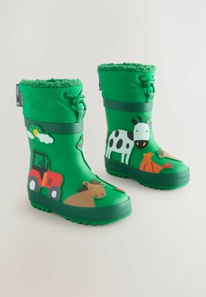 Grüne Gummiregenstiefel mit einem gesteppten Design, versehen mit Tier- und Traktorgrafiken in mehreren Farben und einer strukturierten, rutschfesten Sohle.