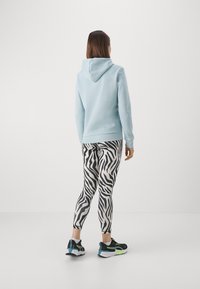 Puma ANIMAL REMIX 7/8 - Leggings - sugared almond