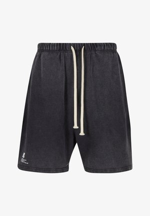 Pantaloni corti neri in cotone con una vita elasticizzata e coulisse, dotati di tasche laterali e una texture leggermente lucida. Logo sul lato sinistro inferiore.