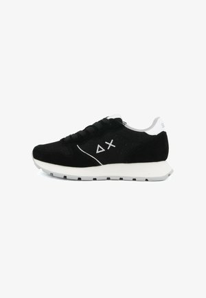 Black and white low-top sneaker with lace-up front, white sole, and white triangle and "X" logo on the side.
