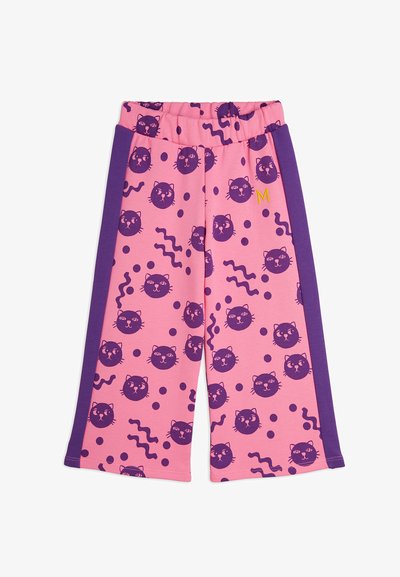 Pink cotton pants with purple side panels, featuring a cat face pattern, wavy lines, and polka dots. Elastic waistband with yellow accent.