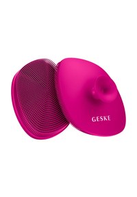 Spazzola per capelli in silicone con un design arrotondato e rosa brillante. Presenta setole morbide e flessibili e una presa centrale per una facile maneggevolezza.