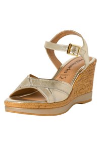Wedge sandal with a cork sole, metallic gold upper, open toe design, and adjustable ankle strap featuring a gold buckle accent.