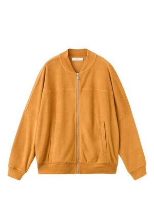 Giacca in pile giallo senape con maniche lunghe, cerniera frontale, due tasche laterali e polsini e orlo a coste.
