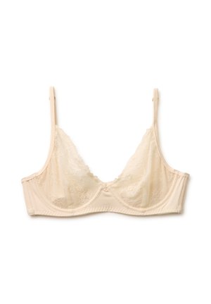Beżowy koronkowy biustonosz z fiszbinami, regulowanymi ramiączkami i falistymi krawędziami, zaprojektowany dla lekkiego wsparcia i delikatnego wyglądu.