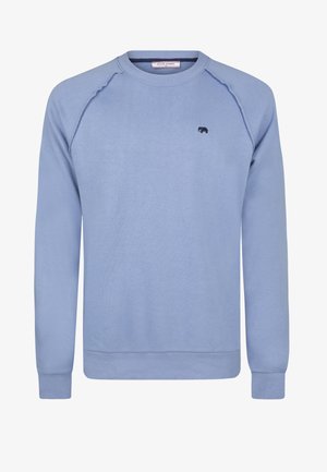 Jasnoniebieska bluza z długimi rękawami, z prążkowanymi mankietami i dekoltem. Posiada małe, ciemne logo słonia na piersi. Miękka tekstura.