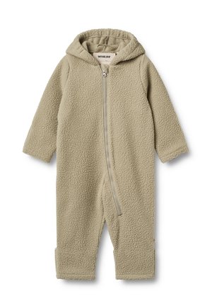 Fleece-yksiosainen haalari vaaleassa beigeissä, jonka edessä on vetoketjukiinnitys ja huppu. Omaavat pitkät hihat ja nilkkareunat, pehmeä rakenne kauttaaltaan.