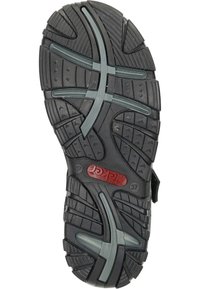 Svart gummiskosula med ett texturerat mönster, spår för grepp och en röd logotyp. Har grå detaljer och en multidirektionell däckdesign.