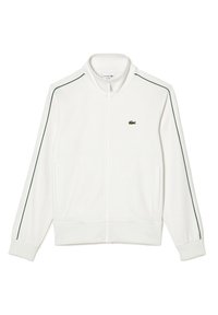 Giacca bianca con zip realizzata in tessuto liscio, con accenti verdi sulle spalle e sulle maniche; presenta due tasche laterali e un piccolo logo.