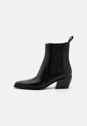 Black leather ankle boot with angled block heel, elastic side panel, pointed toe, and pull tab at back.