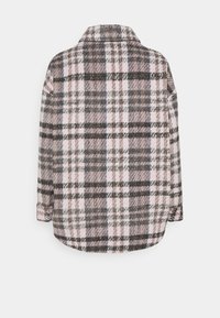 Geruite shirtjas in gedempte tinten van roze, grijs en zwart. Zacht materiaal met een relaxte pasvorm, met een puntige kraag en knopenmanchetten.